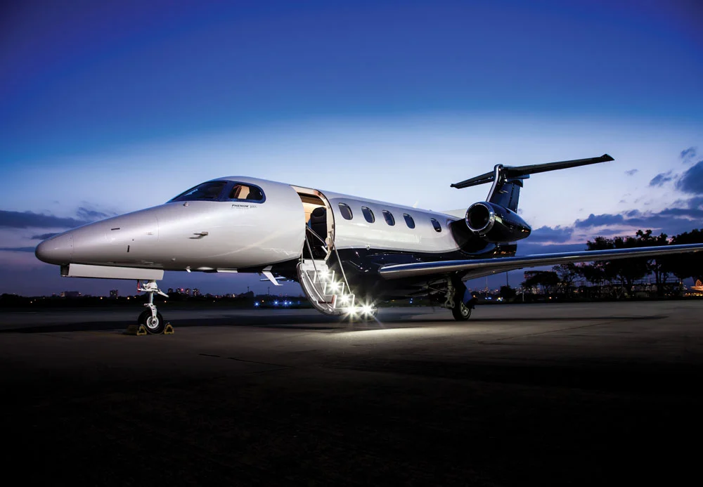 White private jet prepared on the tarmac for an HTH airport transfer